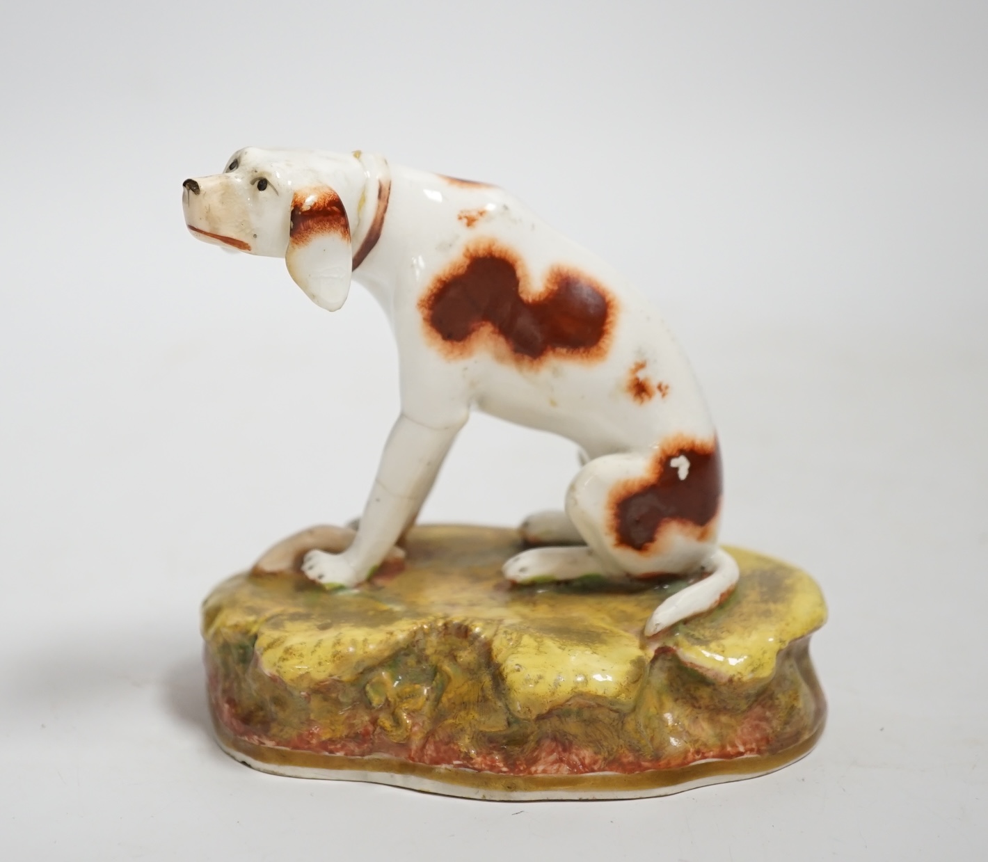 A rare Staffordshire porcelain model of a pointer, c.1830-50, 10cm high